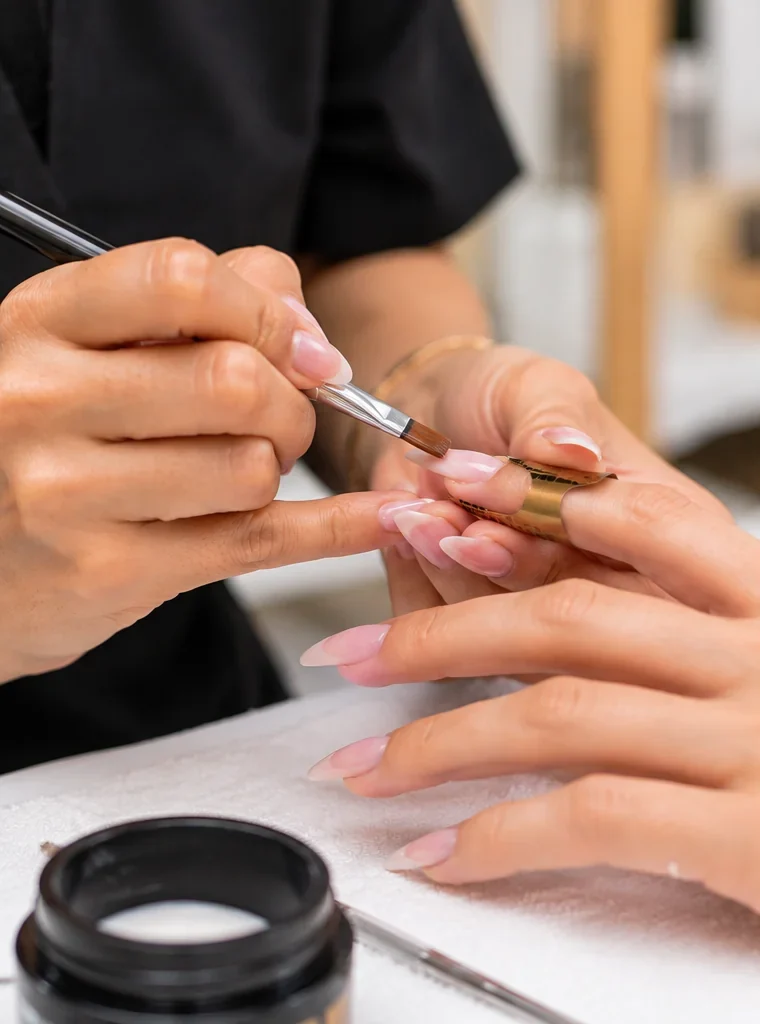 Nail extension application at a professional salon in Vile Parle East, Mumbai